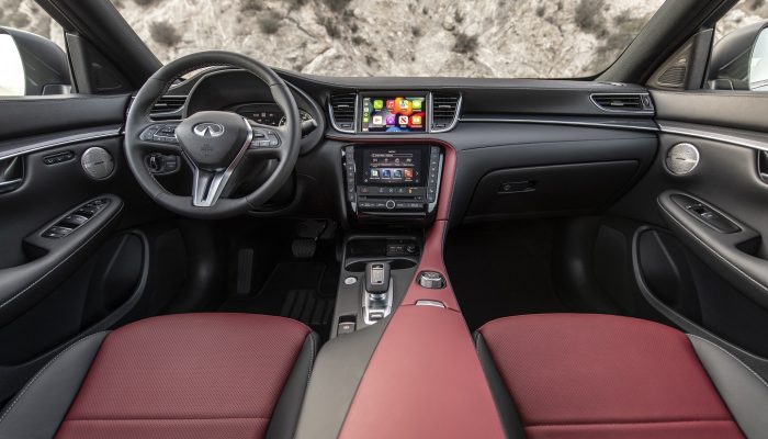 Offering tailored design, convenient connectivity and luxurious practicality, the 2023 INFINITI QX50 builds on its appeal this year with INFINITI Premium Care, additional standard features and new styling options. Headlining the enhancements to the 2023 INFINITI QX50 is a newly available SPORT grade.  In photo: The 2023 QX50 SPORT in Graphite Shadow with Monaco Red interior.