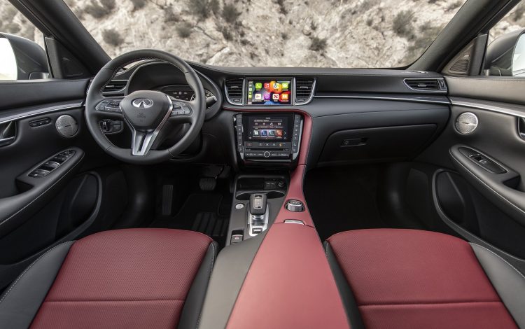 Offering tailored design, convenient connectivity and luxurious practicality, the 2023 INFINITI QX50 builds on its appeal this year with INFINITI Premium Care, additional standard features and new styling options. Headlining the enhancements to the 2023 INFINITI QX50 is a newly available SPORT grade.  In photo: The 2023 QX50 SPORT in Graphite Shadow with Monaco Red interior.